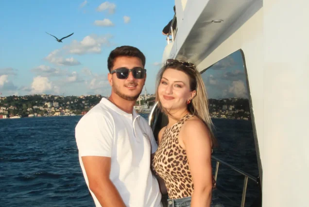 Couple with the Bosphorus Bridge on the sunset cruise
