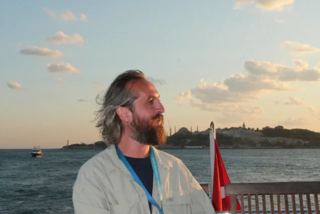 Guest at golden hour on the Bosphorus sunset cruise
