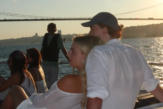 Guests at golden hour on the back deck of the Bosphorus cruise