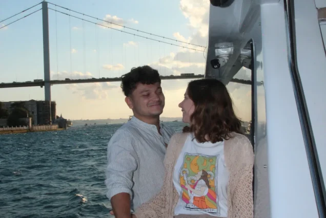 Young couple enjoying the Bosphorus sunset cruise